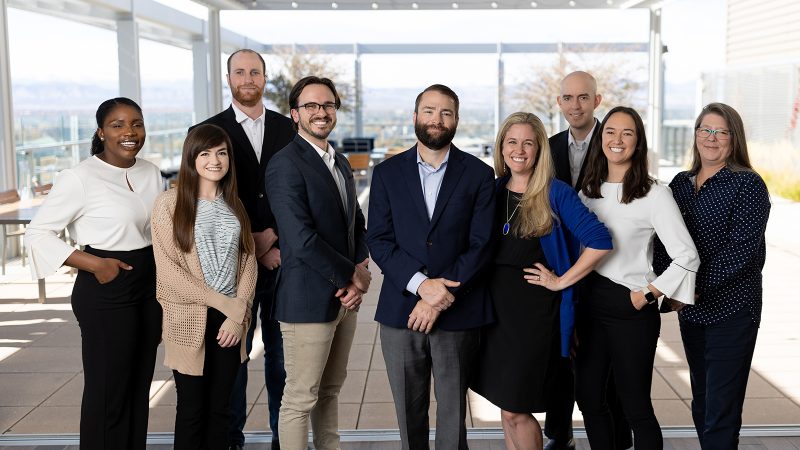 The Lanphier LLP team on a Denver rooftop terrace with mountain views